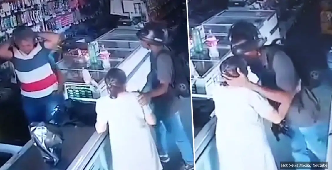 'No, ma'am... I don't want your money': Armed pharmacy robber shows mercy to elderly customer - gives her a kiss instead