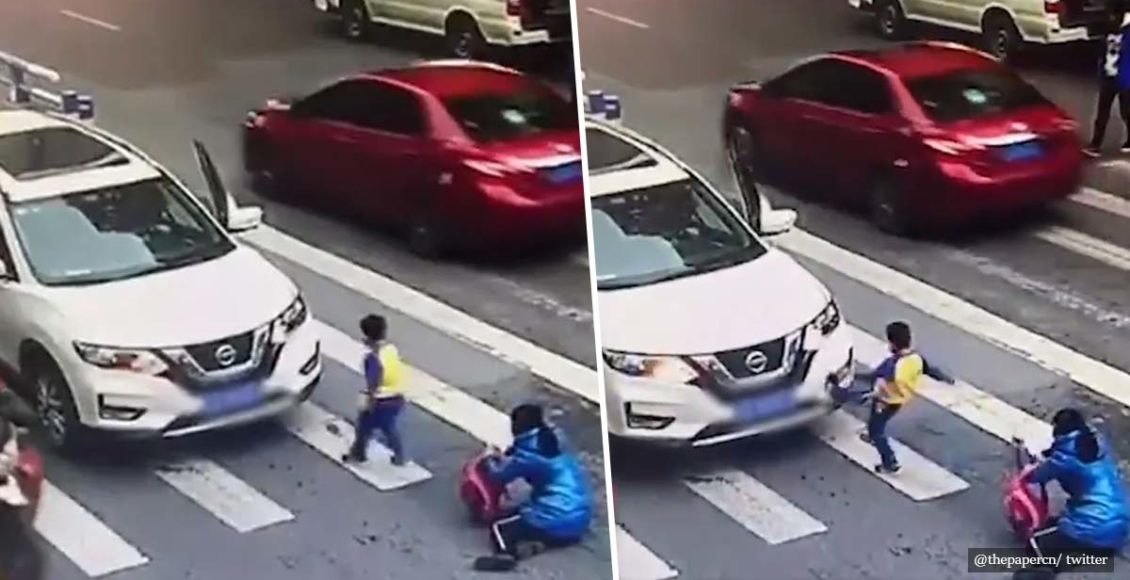 Furious little boy kicks car and tells off driver after he hits his mother and him while they cross the road