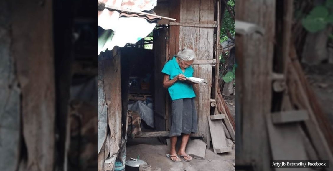 Poor Old Woman With No Electricity Reads Bible Faithfully Outside Her Hut, Capturing The Hearts Of Many