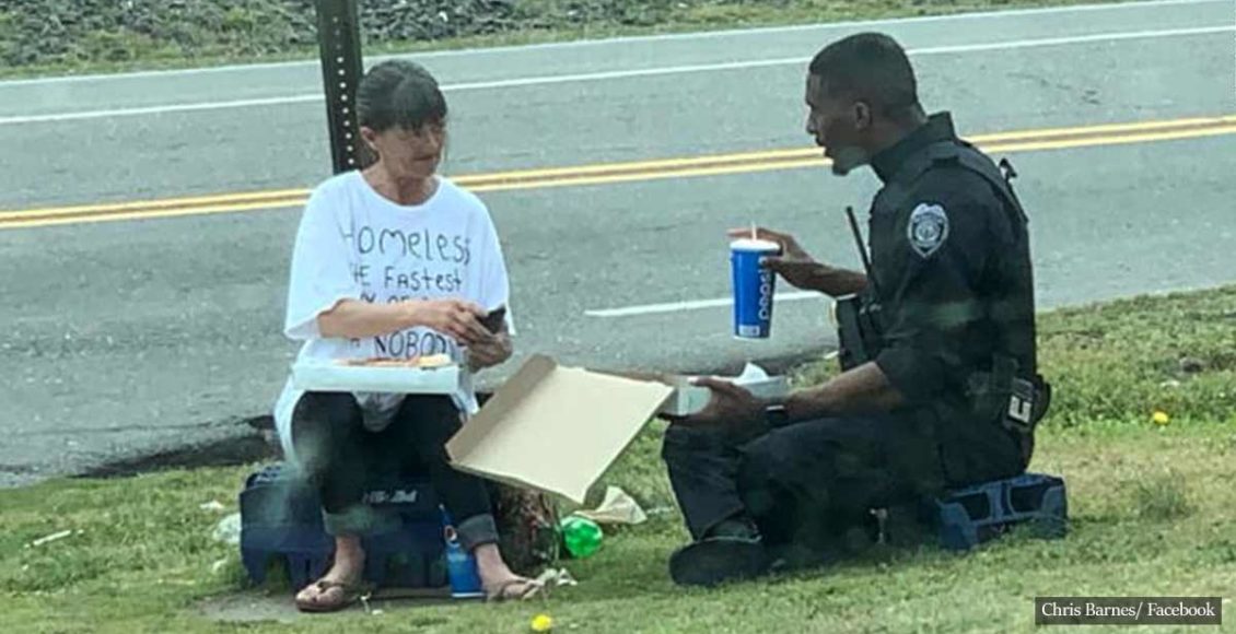 Heartwarming photo shows police officer sharing pizza with homeless woman
