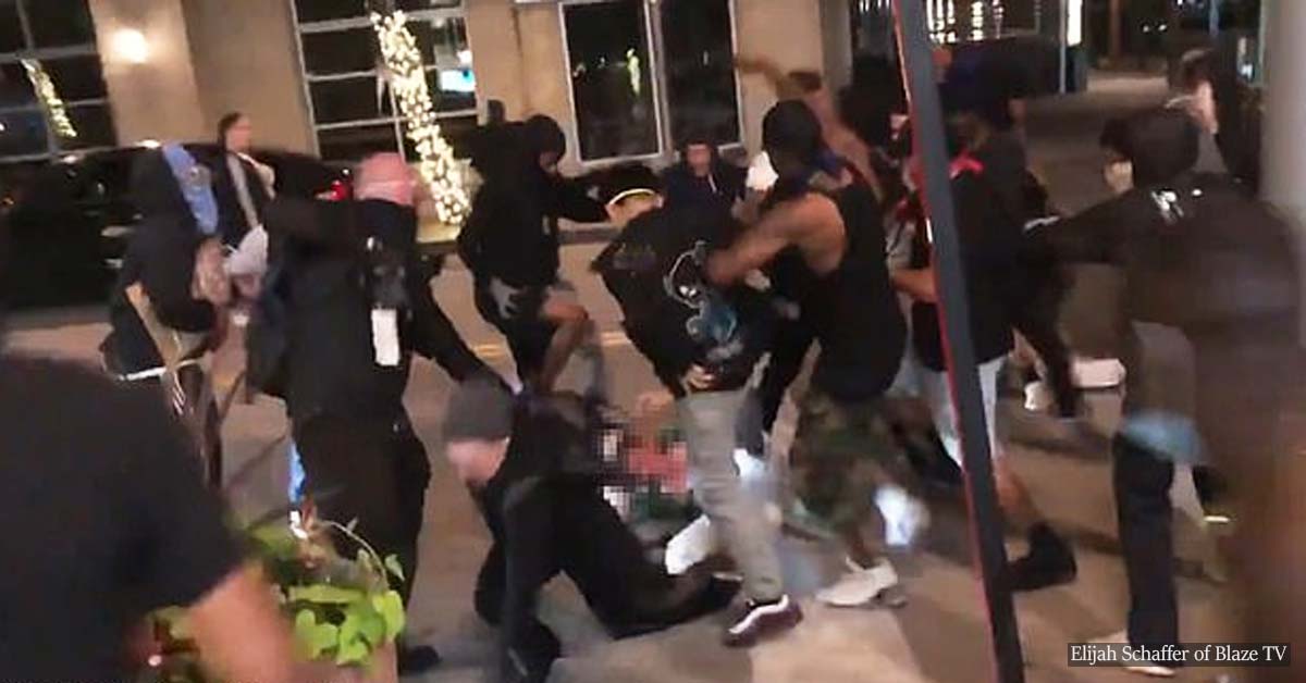 Rioters in Dallas hurl ROCKS at a store owner 'attempting to defend business' amid the nationwide protests