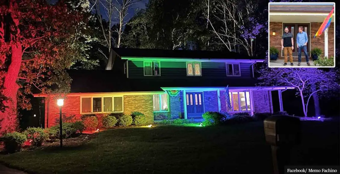 Gay couple told to remove Pride flag from home cover it with rainbow floodlights instead