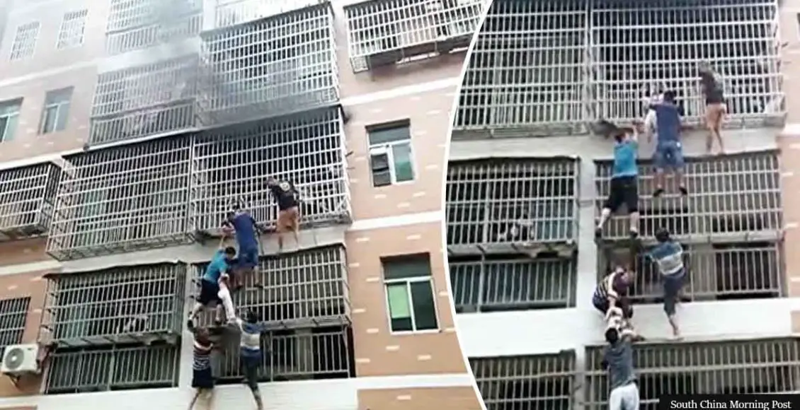 People Form Human Ladder To Rescue Two Girls Trapped Inside A Burning Apartment