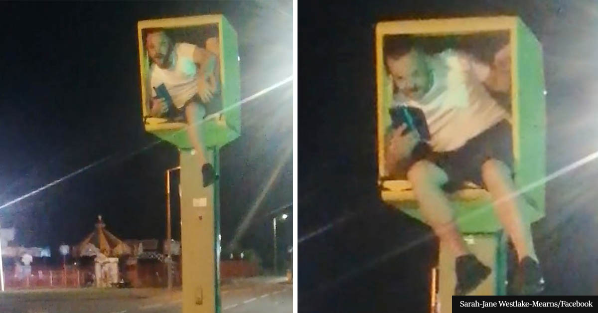 Prankster climbs into speed camera and flashes cars with his phone