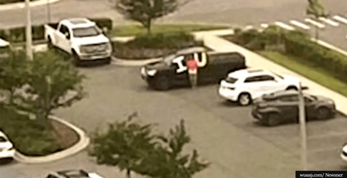 Husband holds "I love you" sign every day in hospital parking lot while wife is in ICU